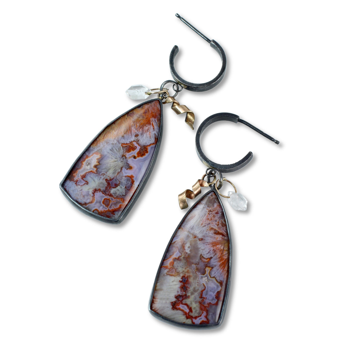 Pair of earrings with large, teardrop-shaped natural stone pendants, gold accents, and Herkimer diamonds on a white background.