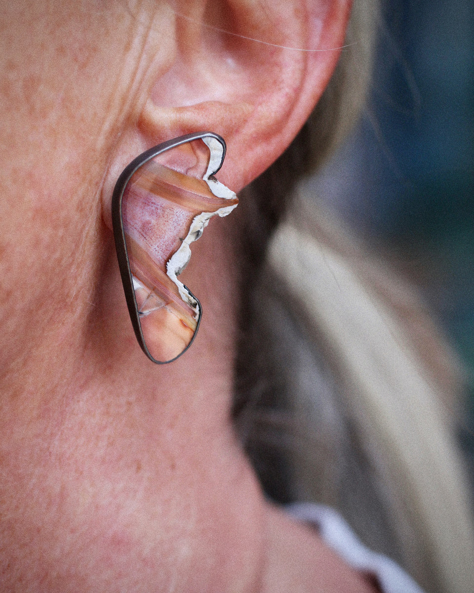 Sumatran agate slice butterfly wing earrings with exposed raw edges in oxidized silver on white background