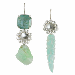 Mismatched sterling silver earrings with faceted aquamarine, raw green calcite, carved chalcedony leaf drops, and handmade satin silver baubles photographed on white.