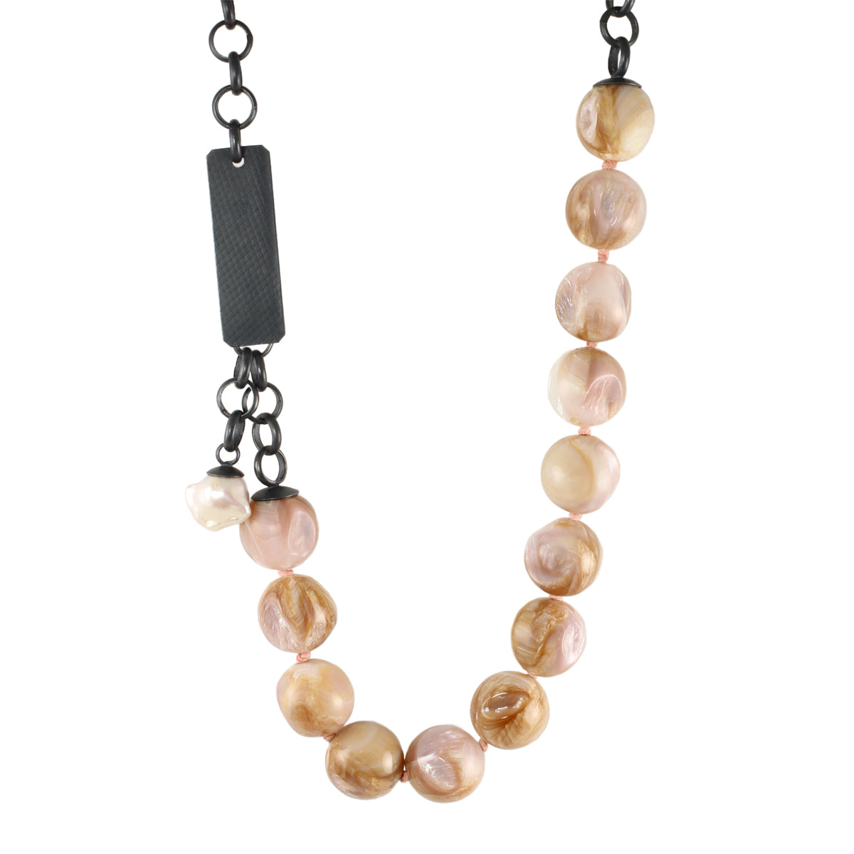 One-of-a-kind shell bauble necklace with oxidized sterling silver chain, front clasp, and small baroque pearl dangle on a white background.