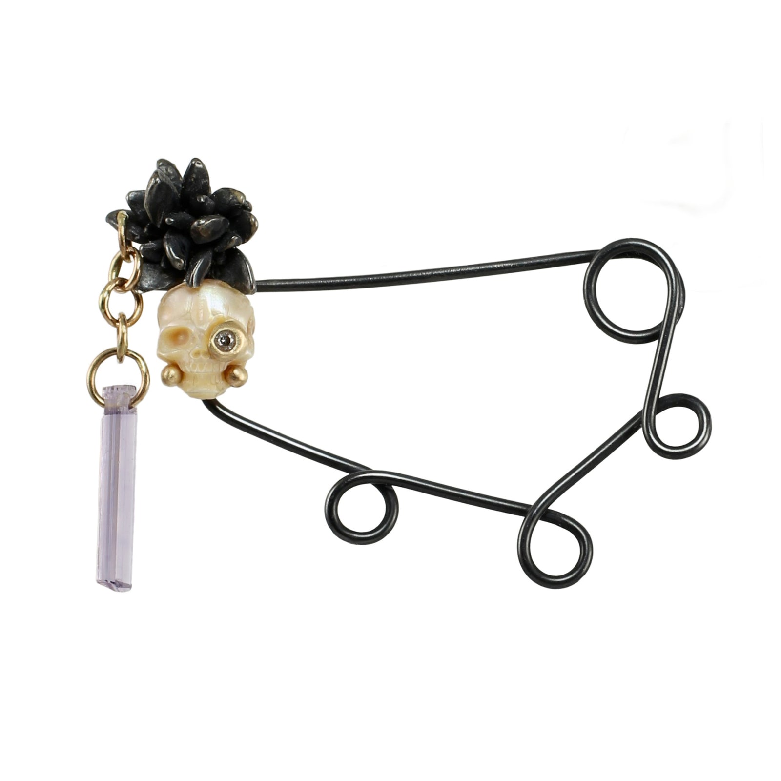 Oxidized sterling silver Calavera fibula with hand-carved pearl skull, diamond eye, cast silver buds, recycled gold links, and lavender scapolite crystal.