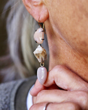 Close-up of peach moonstone, natural druzy shell, and pink moonstone drop earring showing its soft blush tones and movement.