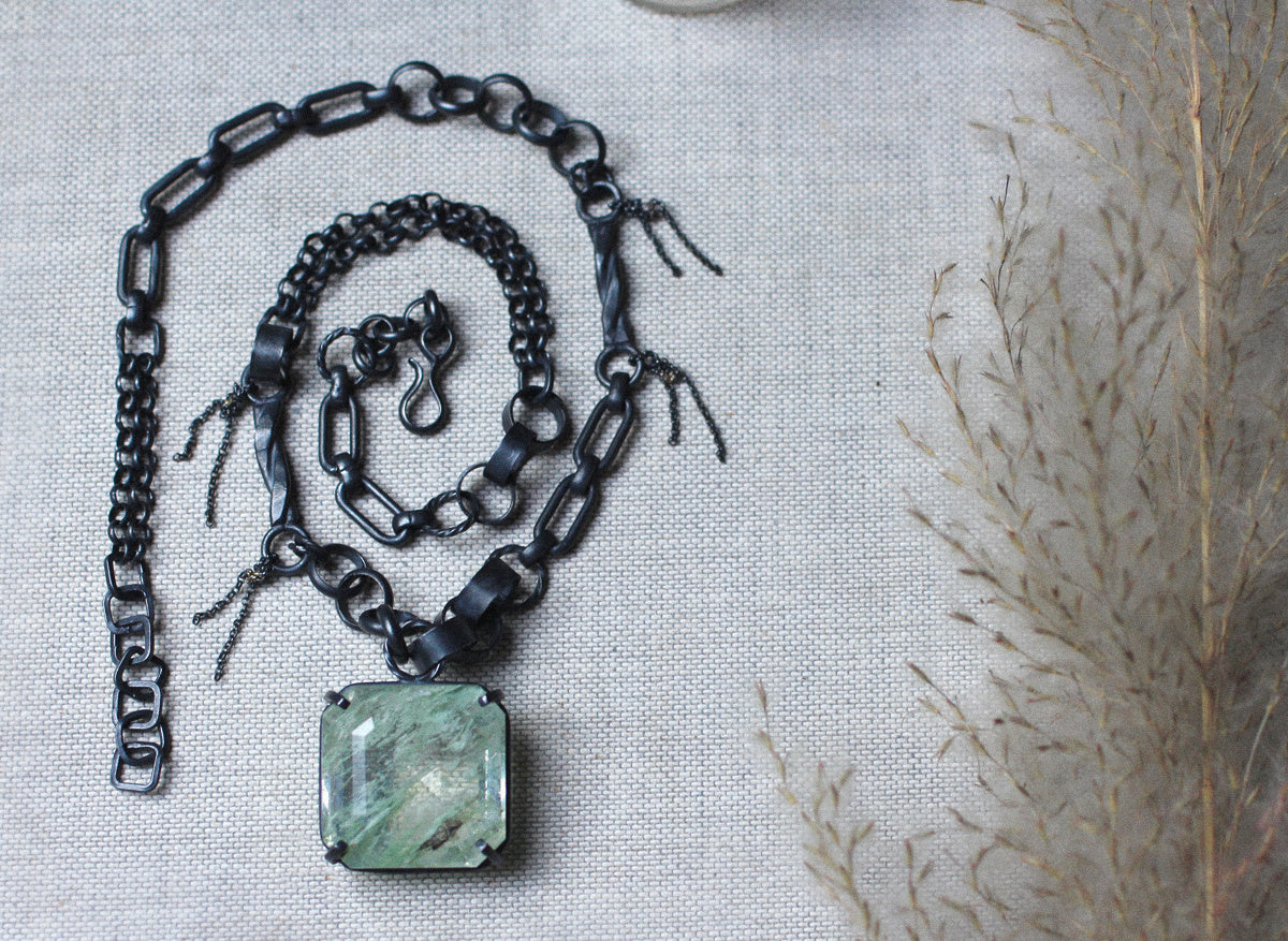 One-of-a-kind garden quartz pendant necklace with mixed oxidized silver links, small chain fringe, and tiny 14k gold solder details shown on white.
