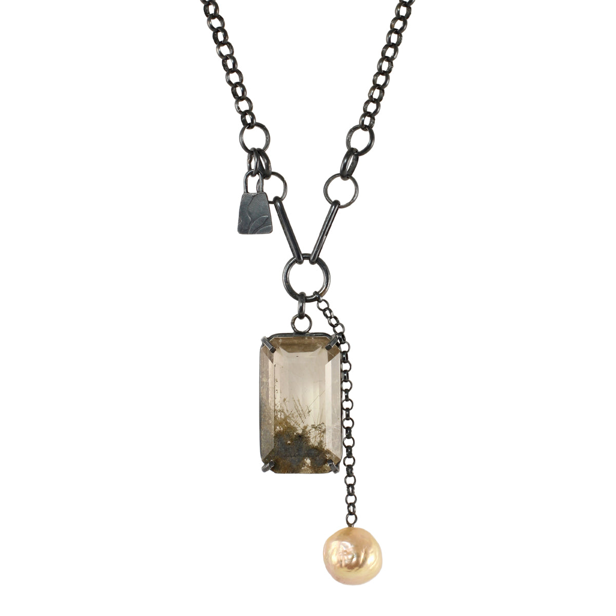 Rutile quartz talisman necklace with baroque pearl and mixed oxidized silver chain on white background.