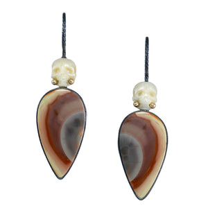 One-of-a-kind Pearl and Imperial Jasper Calavera earrings photographed on white, with carved skulls, recycled 14k gold details, and mismatched teardrop-shaped stones.