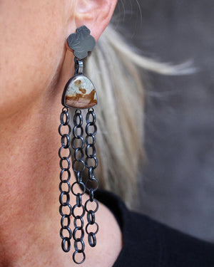 Long and short polychrome jasper earrings worn, showing oxidized silver chain movement and embossed silver tops