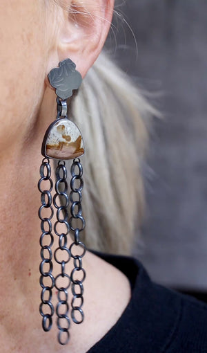 Video showing long and short polychrome jasper earrings worn, showing oxidized silver chain movement and embossed silver tops