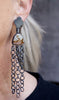 Video showing long and short polychrome jasper earrings worn, showing oxidized silver chain movement and embossed silver tops