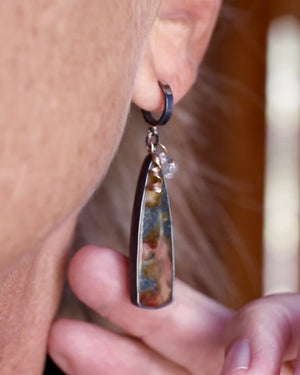 Video of marcasite and herkimer diamond melange earrings worn on ear and showing movement, oxidized sterling silver drop earrings with gold accents