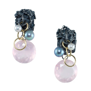 One-of-a-kind Fragment earrings with fused, textured oxidized sterling silver, luminous silver and white pearls, warm gold fill rings, and large faceted rose quartz drops in a soft translucent pink photographed on a white background.